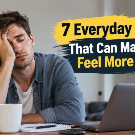 Everyday habits that can make you feel more tired, shown by an exhausted man working at a desk.